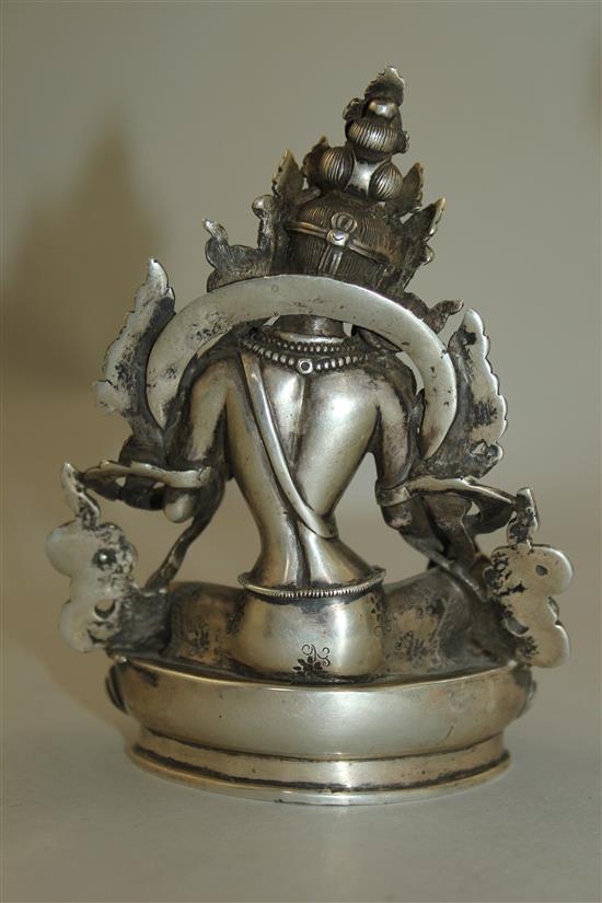 An unusual Tibetan silver seated figure of Green Tara, possibly 19th century, 11.7cm